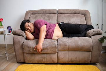 Obraz premium Relaxed Man Peacefully Napping on Comfortable Couch at Home