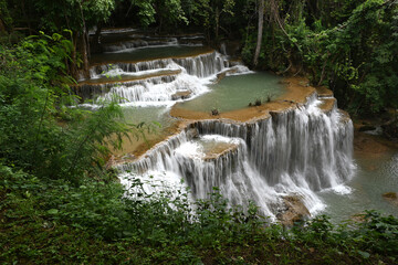 Amazing waterfall in the tropical forest of a national park in Thailand.Beauty in nature.