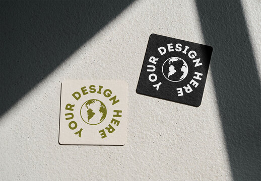 Mockup Of Two Customizable Square Coasters