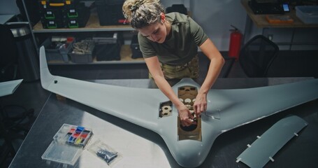Well Lit, Organized Drone Factory Features Several Stations Where Engineers Assembling Large UAVs. Concept of Assembly For UAV, Streamlined, Systematic Approach to Modern Defense Production. Top View.