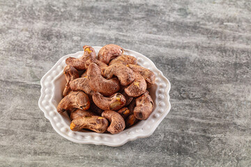 Unpeeled cashew nuts in the bowl