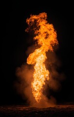 A large flame is shooting out of the ground, creating a dramatic