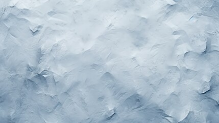 Obraz premium A textured abstract background in shades of blue and gray, resembling crumpled paper or a soft, cloudy surface.