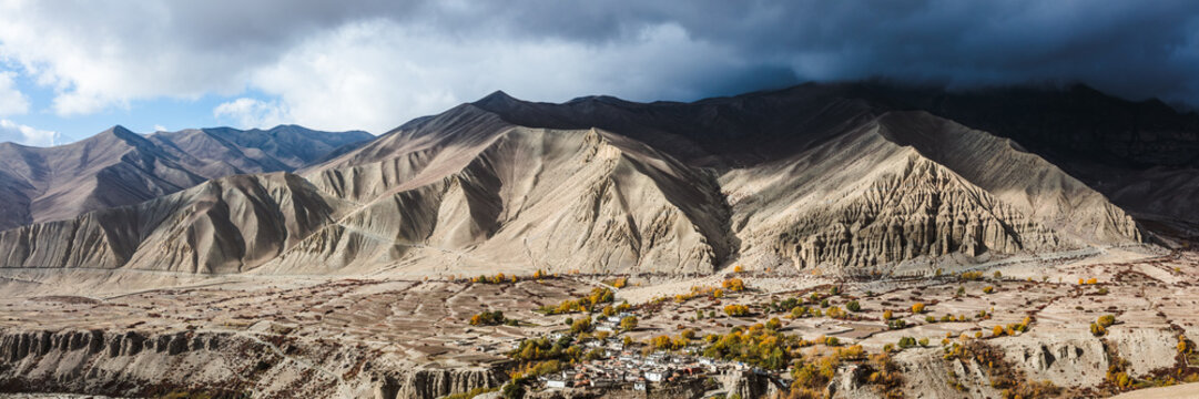 Panoramic of valley with dark clouds, Upper Mustang region, Nepal
