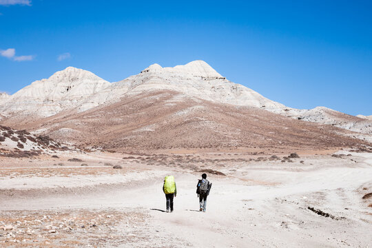 Hikers on a track, Upper Mustang region, Nepal