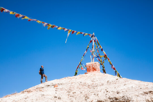 Man looking at prayer flags, Upper Mustang, Nepal