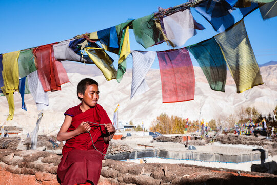 Young buddhist monk praying, Upper Mustang, Nepal
