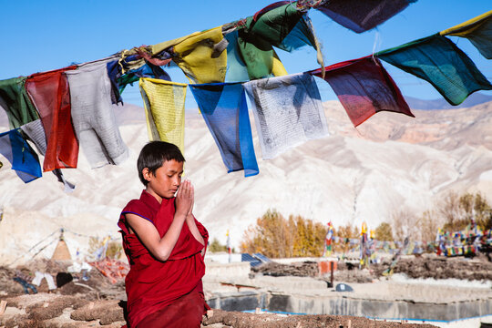 Young buddhist monk praying, Upper Mustang, Nepal