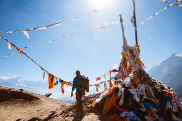 Man relaxing on mountain high pass, Upper Mustang, Nepal