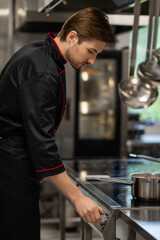 Confident male chef working in restaurant kitchen