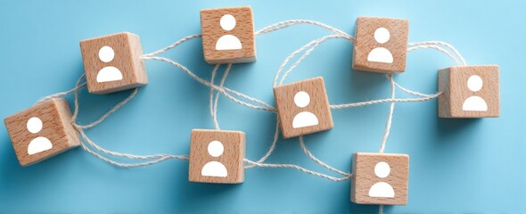 Wooden blocks with user icons connected by white string on blue.