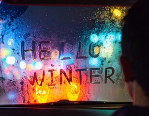 A heartwarming hello winter message on a misty window overlooking a colorful city lights bokeh