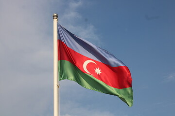 Azerbaijan National Flag Waving Against Blue Sky
