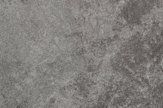 Grey stone texture background with natural grain and rough concrete surface, ideal for food photography, product presentation, design mockups, menu layouts and advertising compositions with copy space