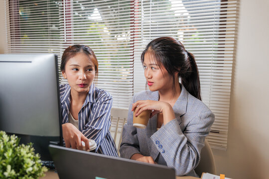 Asian young women business team work online, home office colleagues learn, collaborate, discussing project ideas on computer, effective remote teamwork for business success