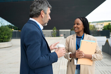 Business people networking and talking during coffee break