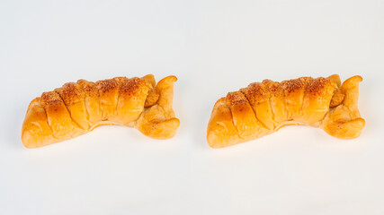 Baked bread stuffed with chicken sausage on white background