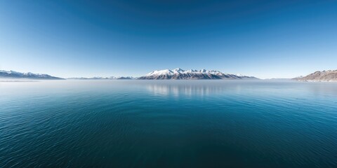 Partially blurred blue cup with a heart, festive Christmas lights bokeh background, surrounded by tree branches and gingerbread cookies, holiday season