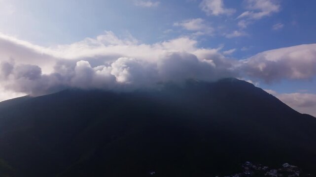Aerial Pan of Majestic Cerro de la Silla Mountain Shrouded in Storm Clouds