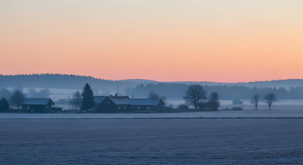 Fototapeta premium Rural landscape at dawn with farm buildings and pastel sky