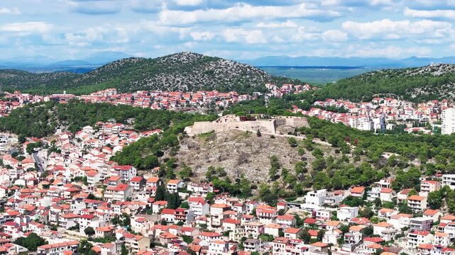 Barone fortress and Sibenik city around, aerial orbit view