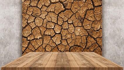 Closeup of dry cracked earth on wooden surface used as background for text and layout, emphasizing surface textures
