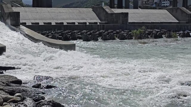 New Taipei City, Xindian District, Taiwan. November 15, 2025. Photo of Xiaobitan Xindian River Riverside Park&mdash;Fish Ladder, egret, night heron, waterfall, downstream flood Bitan Bridge