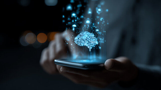 A person's hand interacts with a holographic brain above a smartphone, illustrating innovation and digital intelligence. - Powered by Adobe