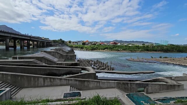 New Taipei City, Xindian District, Taiwan. November 15, 2025. Photo of Xiaobitan Xindian River Riverside Park&mdash;Fish Ladder, egret, night heron, waterfall, downstream flood Bitan Bridge