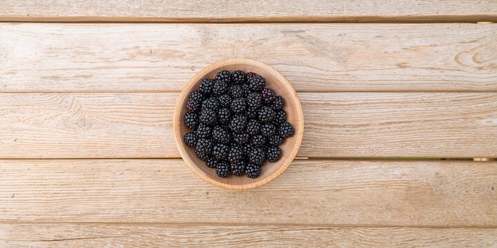 Bookshelves filled with books in a library setting used as a background for text layout, library awareness day