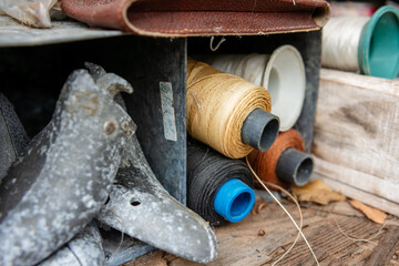 Sewing thread roles in a cobbler's desk