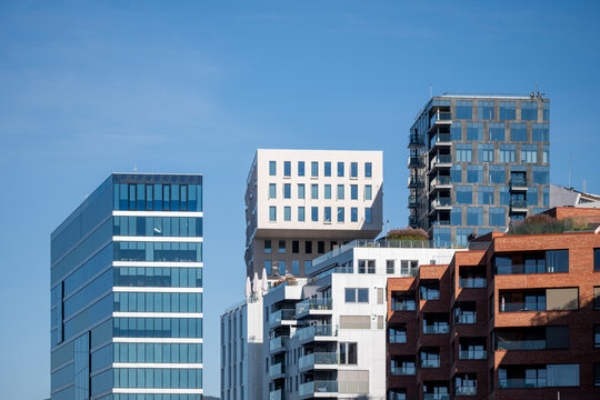 Architecture skyline oslo barcode towers urban cityscape reflections geometry corporate district clean facade expressing commercial clarity across Oslo’s modern architectural corridor