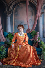 A red-haired girl in a medieval outfit at a ball in a castle interior