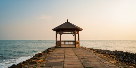 Male student using a laptop outdoors on campus, focusing on study efficiency, Earth Day