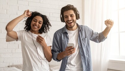 Joyful couple listening music and dancing.