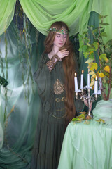An elven story. A girl with long hair in a magical forest studio