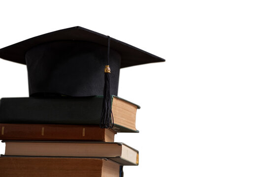 Stacks of books, Square academic cap or graduation hat. Concept of education, knowledge, intelligence