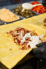 Sliced ingredients for shawarma and the preparation process on a work surface