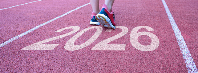 New Year 2026 Start or Goals 2026 text written on the road in the middle of the asphalt road at sunset and journey towards success, career goals and life vision.