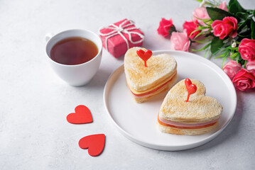 Ham tomato and cheese canape sandwiches in the form of heart for Valentine's day holidays