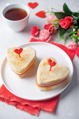 Ham tomato and cheese canape sandwiches in the form of heart for Valentine's day holidays