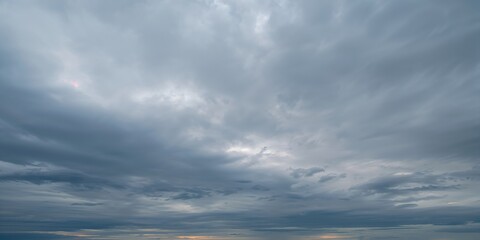 Obraz premium Asian woman tending to a houseplant indoors during morning hours, emphasizing plant care routine