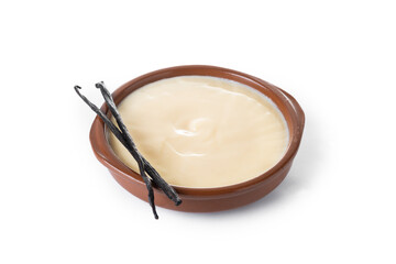 Spanish custard served in a bowl with vanilla bean isolated on white background