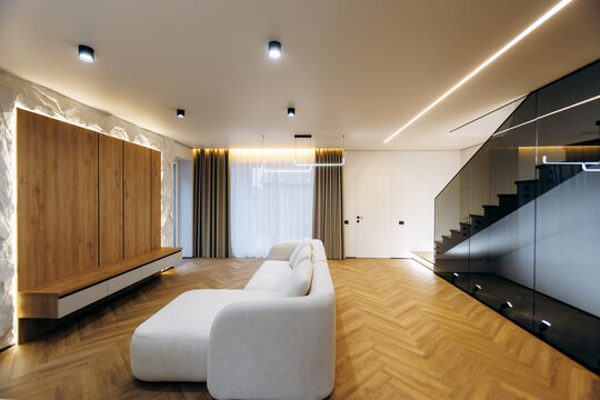 Stylish living space featuring curved furniture and subtle lighting