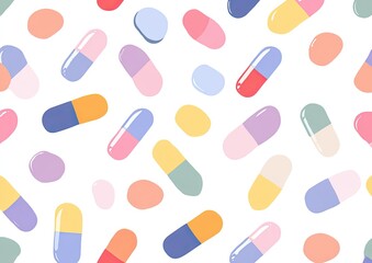 Colorful, cartoonish medication capsules and lozenges scattered on a plain white background