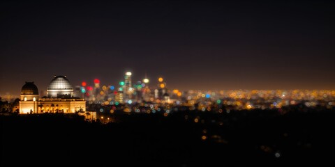Fototapeta premium Night lights at Griffith Observatory captured with blurry effect, emphasizing urban illumination at night