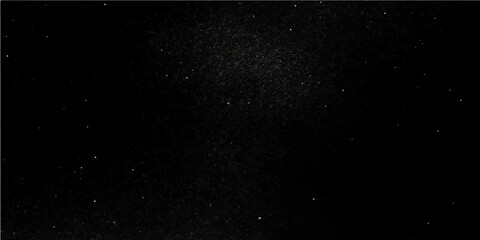 Fototapeta premium Abstract drops of rain on a dark black background texture resembling a starry night sky
