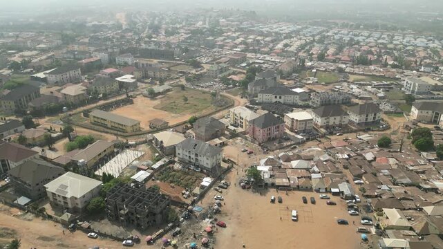 Aerial Video of a satellite town within Abuja, Nigeria showing where city infused with slum