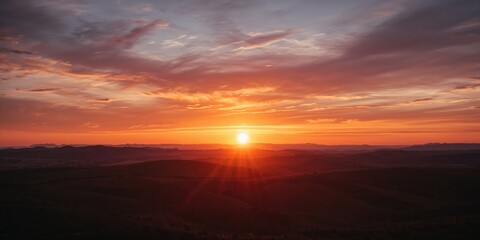 Sunset over scenic hills creating a colorful sky, ideal for landscape photography, Earth Day