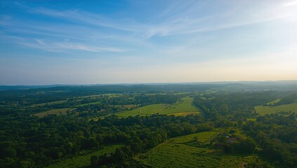 Obraz premium Green Land aerial drone shot, emphasizing seasonal plant growth and landscape preservation